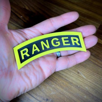 3D Army Ranger tab displayed in hand, featuring the iconic yellow and black design.