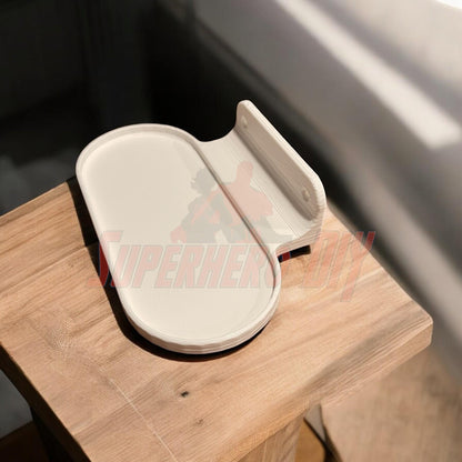 3D-printed Google Nest Hub wall mount on table, includes screws for easy installation.