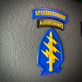Special Forces display insignia featuring arrowhead, Airborne tab, and yellow dagger on blue background.