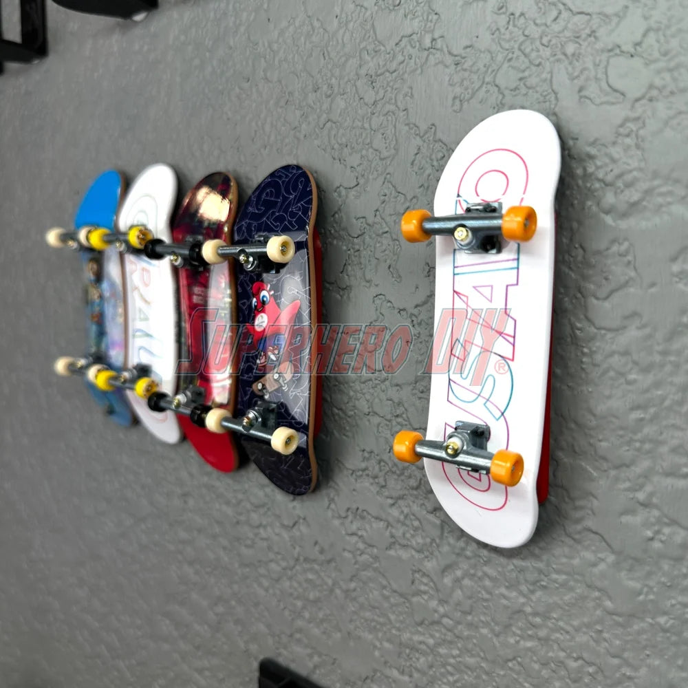 Tech Deck fingerboards displayed on magnetic wall-mounted rack, artwork facing outward