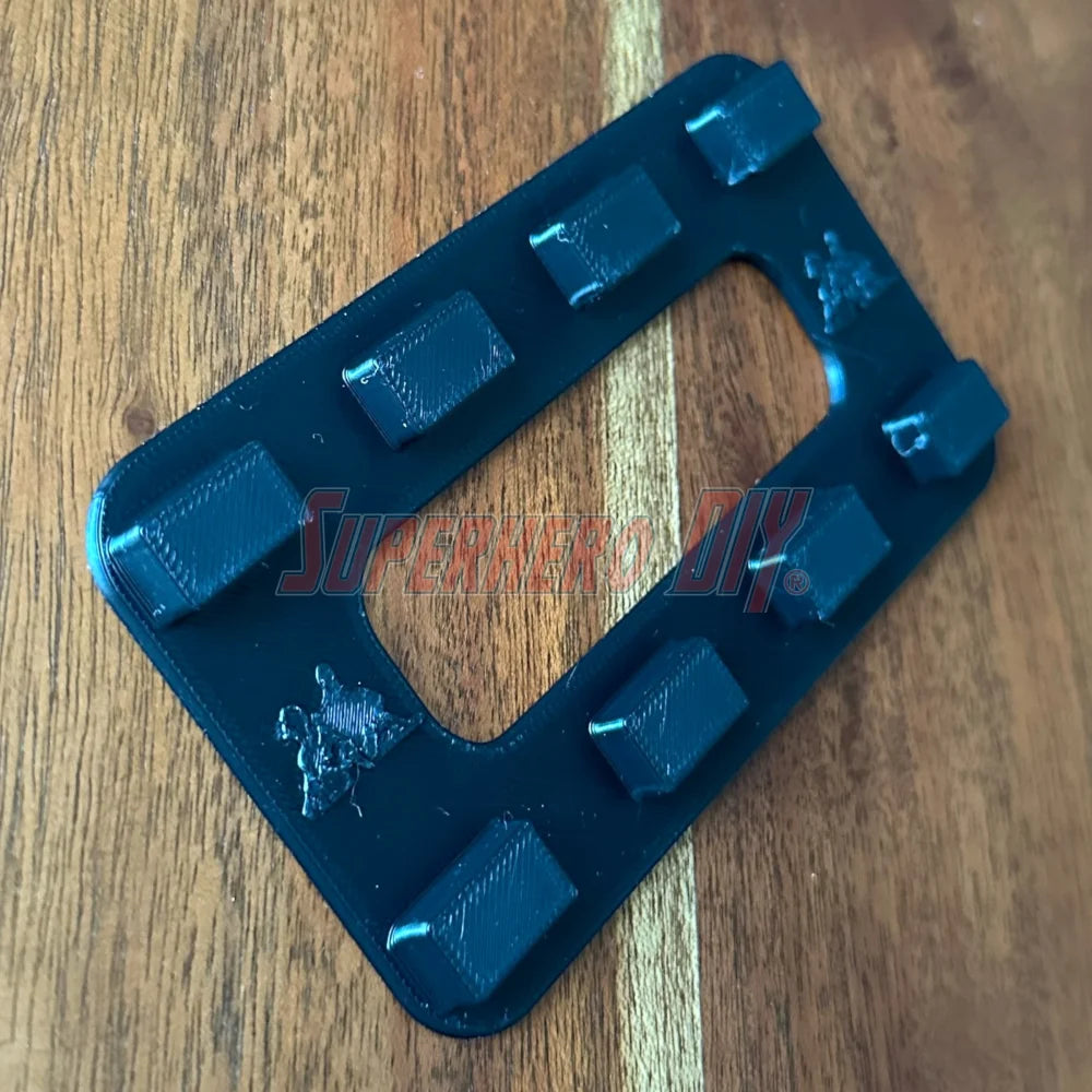 Close-up of magnetic Tech Deck wall mount with embedded magnets and Command Strip backing
