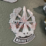 Master Gunner Badge display insignia mounted on a wall as a 3D display piece.