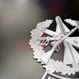 Close-up view of Master Gunner Badge display insignia featuring detailed design on a black background.