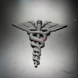Army Medical Corps caduceus wall display in black, featuring twin serpents and wings on a dark background.