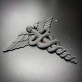 Army medical corps caduceus wall display in black, featuring twin serpents and wings on a sleek surface.