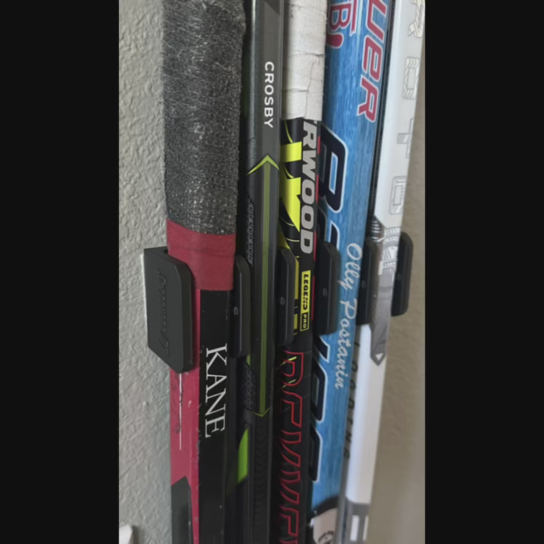 Our 5-stick hockey stick holder keeps the sticks upright and organized on the wall, great for Mini-Sticks or knee hockey