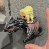 Drogon and Daenarys funko pop, displayed on the wall with a custom made wall mount
