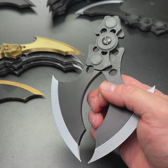Hand holding MAGNETIC Folding Arkham Batarang Cosplay Prop - 10" version with neodymium magnets in a closed position.