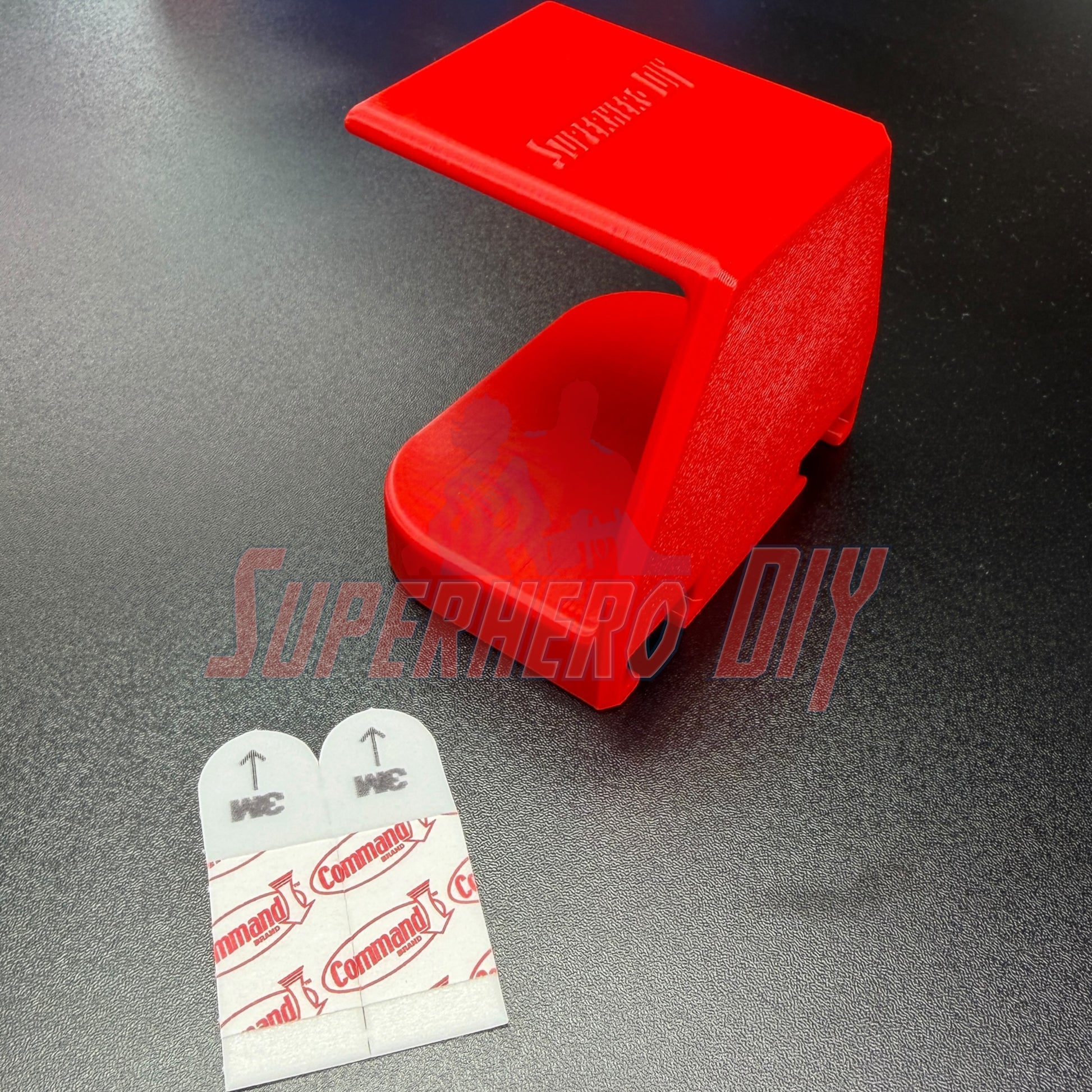 Under-desk PS5 controller mount in red, designed for easy storage and access without drilling.
