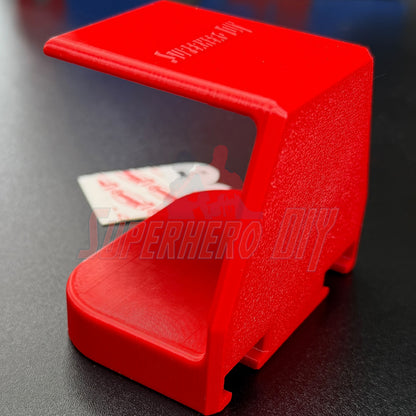 Under-desk PS5 controller mount in red color, designed to securely hold your PS5 controller out of the way.
