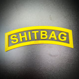 SHITBAG tab in black and yellow, perfect gag gift for soldiers and battle buddies.