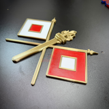 Signal Corps insignia featuring crossed signal flags and a central flaming torch for display.