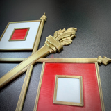 Close-up of Army Signal Corps insignia featuring crossed signal flags and flaming torch, perfect for display.