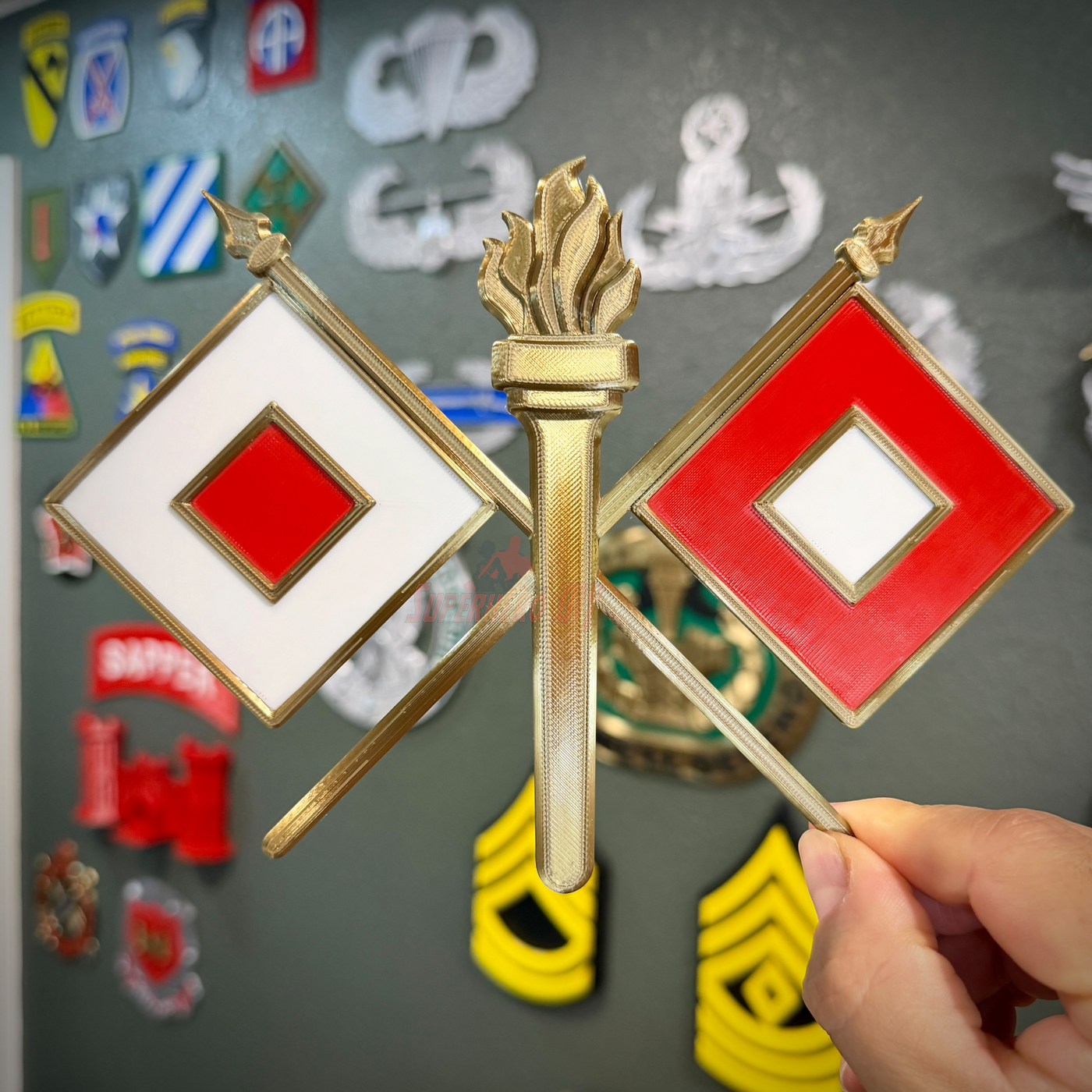 Signal Corps insignia featuring crossed signal flags and a flame, perfect for display or shadow box.