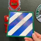 3rd Infantry Division display insignia, 3D-printed blue and white patch for military service recognition, in hand.