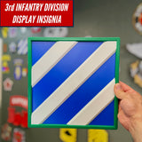 3rd Infantry Division display insignia showcased in hand, bold blue and white design for honoring military service.