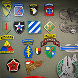 3rd Infantry Division display insignia patches on wall showcasing military unit symbols and pride.