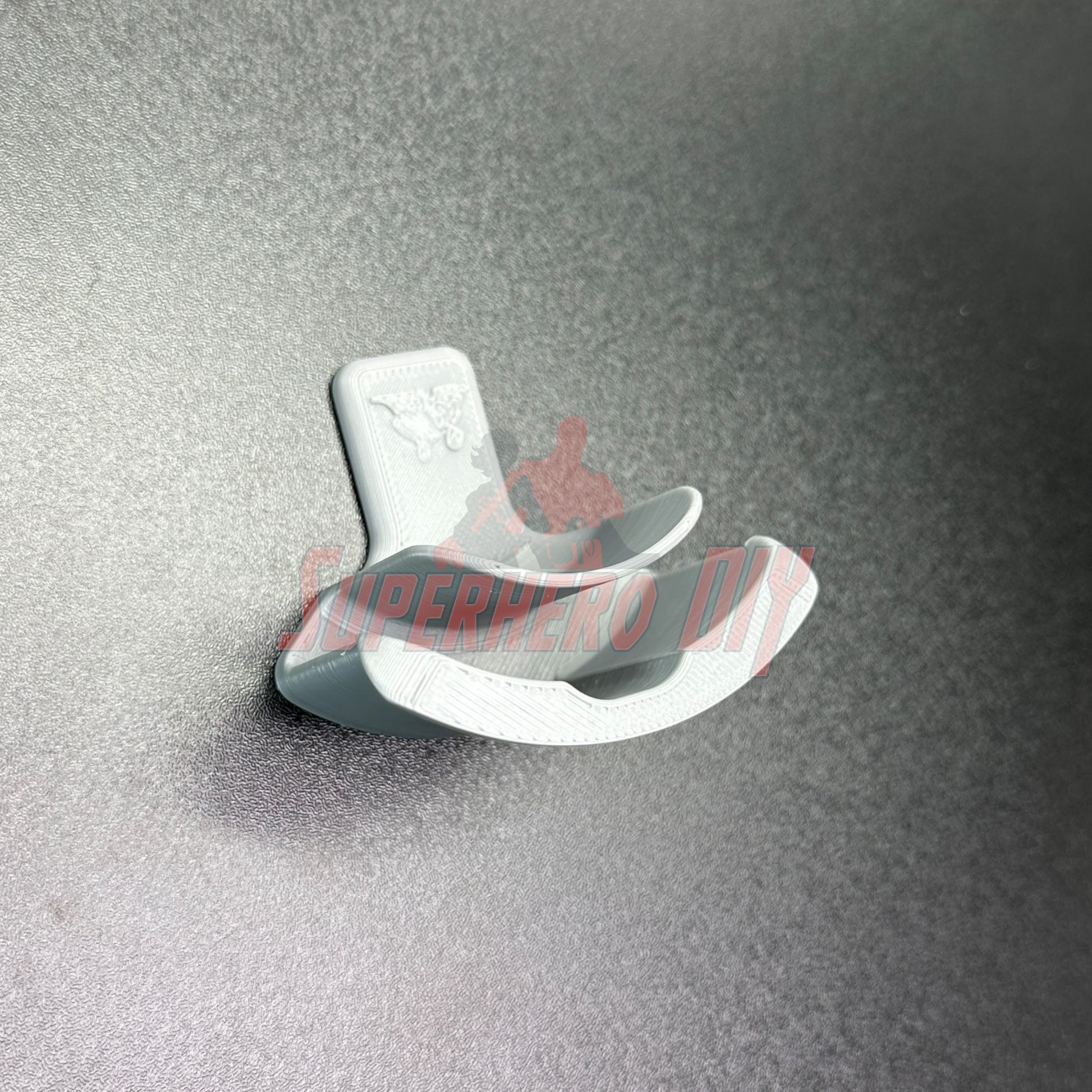 Wall-mounted hook for hat display, perfect for organizing and showcasing caps. Optimal use as a hat display wall mount.