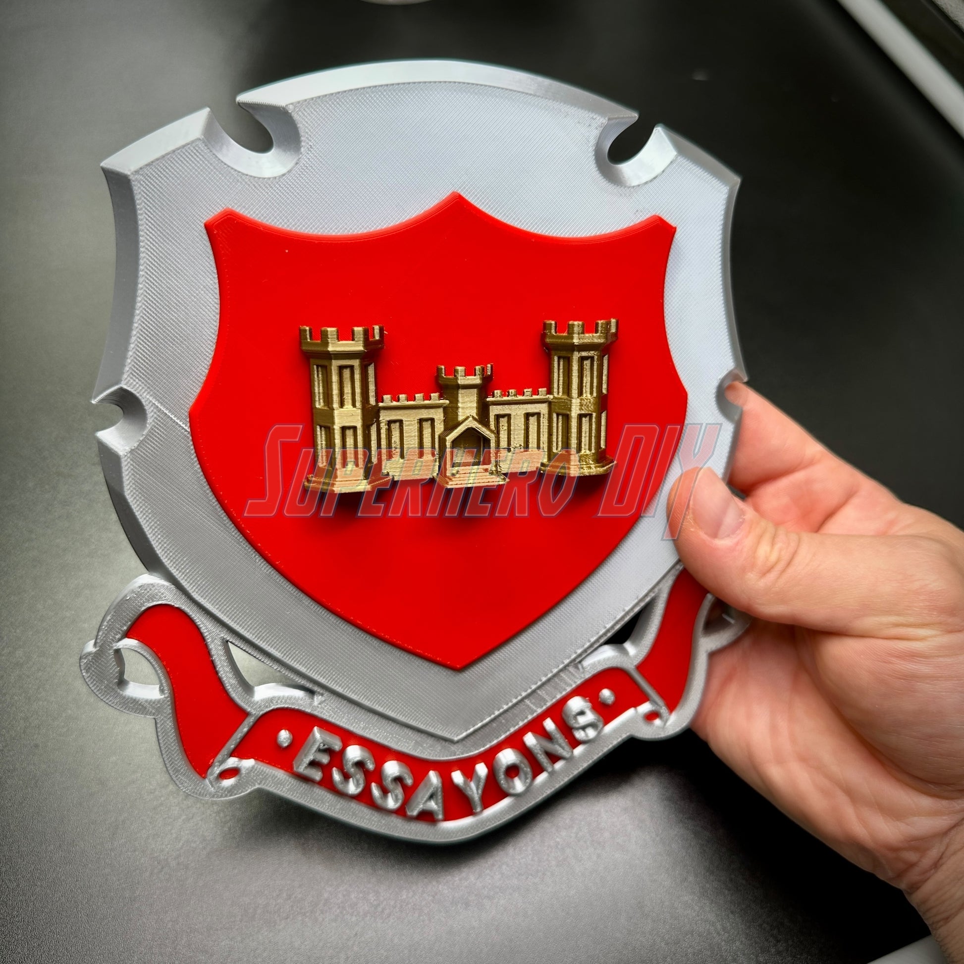Engineer Regimental Crest –  Multiple Sizes Available for Shadow Box or Wall Display held by hand, featuring iconic castle design and Essayons scroll.