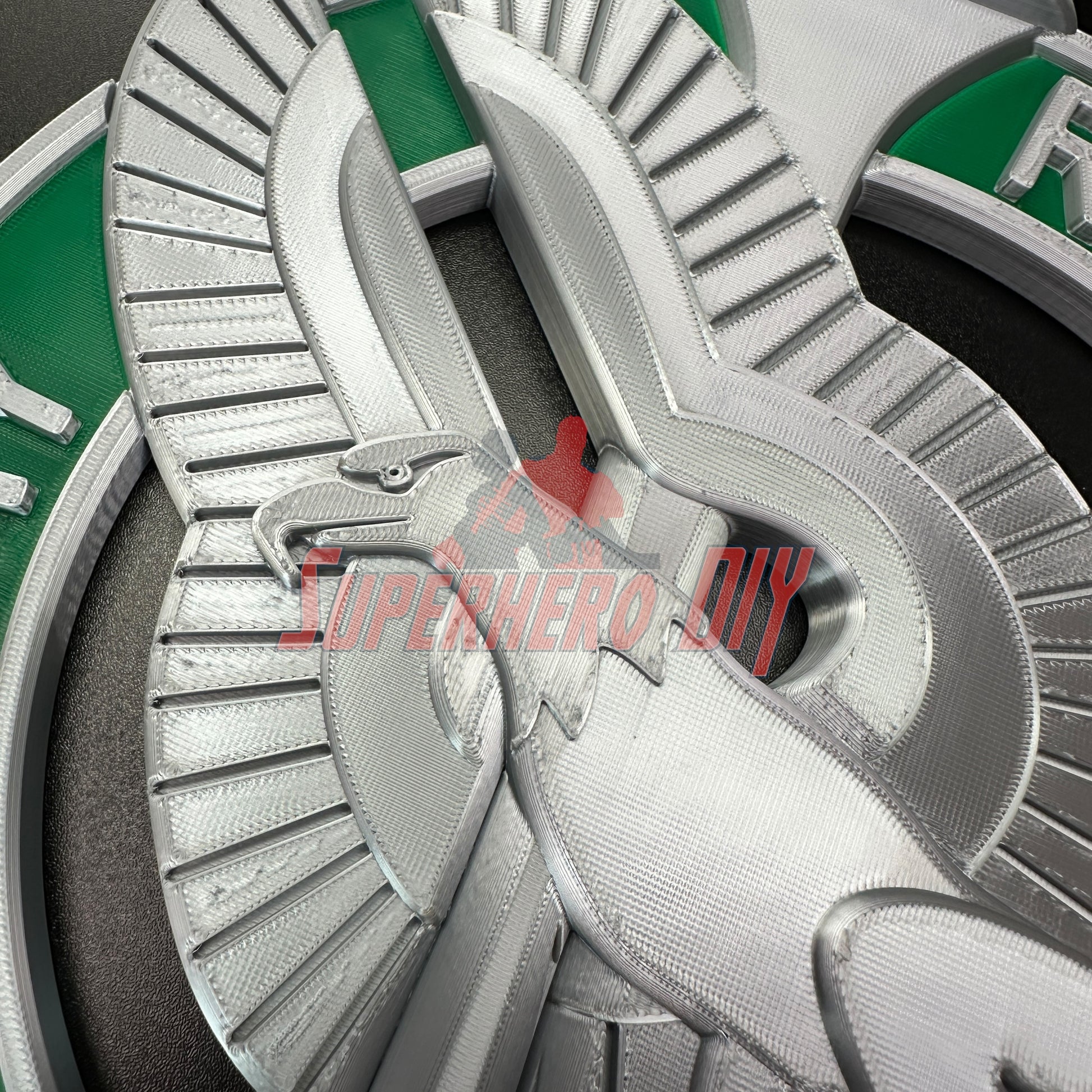 Detailed Army recruiter badge insignia in silver with green accents, featuring eagle, torch, and stars prominently displayed.