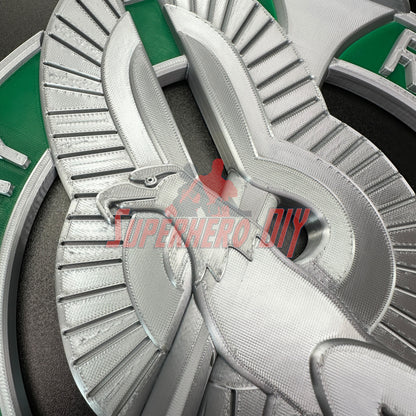 Detailed Army recruiter badge insignia in silver with green accents, featuring eagle, torch, and stars prominently displayed.