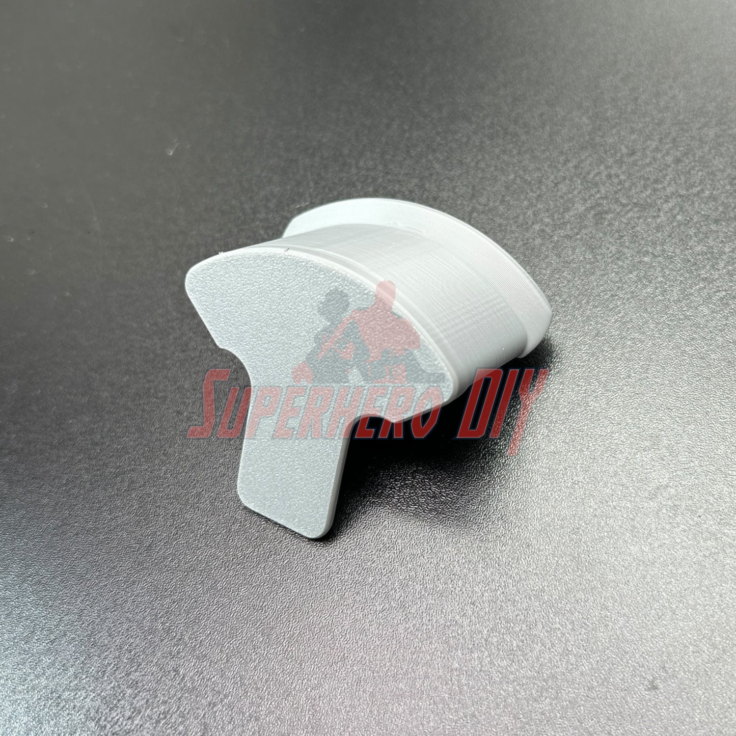 Hat display wall mount in gray, ideal for organizing and displaying caps with a simple wall hook design.