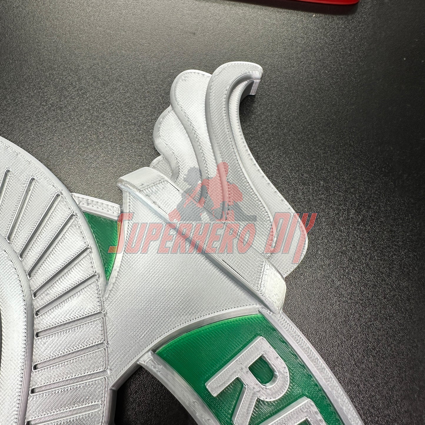 Detailed view of Army Recruiter badge insignia with raised eagle, torch, and stars on a wall display