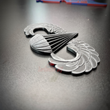 Subdued Airborne Jump Wings displayed on a black surface, highlighting the intricate design of the Parachutist Badge.