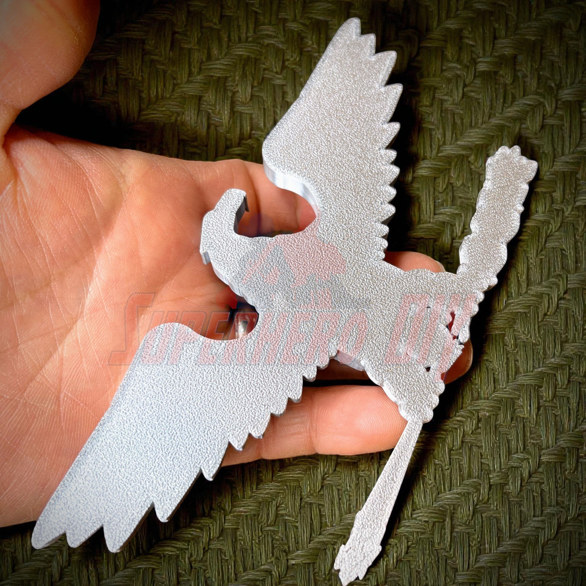 Hand holding Colonel Captain rank insignia O-6 replica with intricate details, suitable for collectors or cosplayers.