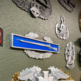 Infantryman Badge replica display with 1795 Springfield musket on blue bar and oak wreath.