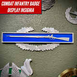 Combat Infantry Badge display insignia featuring a Springfield musket on an infantry-blue background.