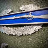 Close-up of Infantryman Badge featuring a musket on infantry-blue bar, ideal for display.
