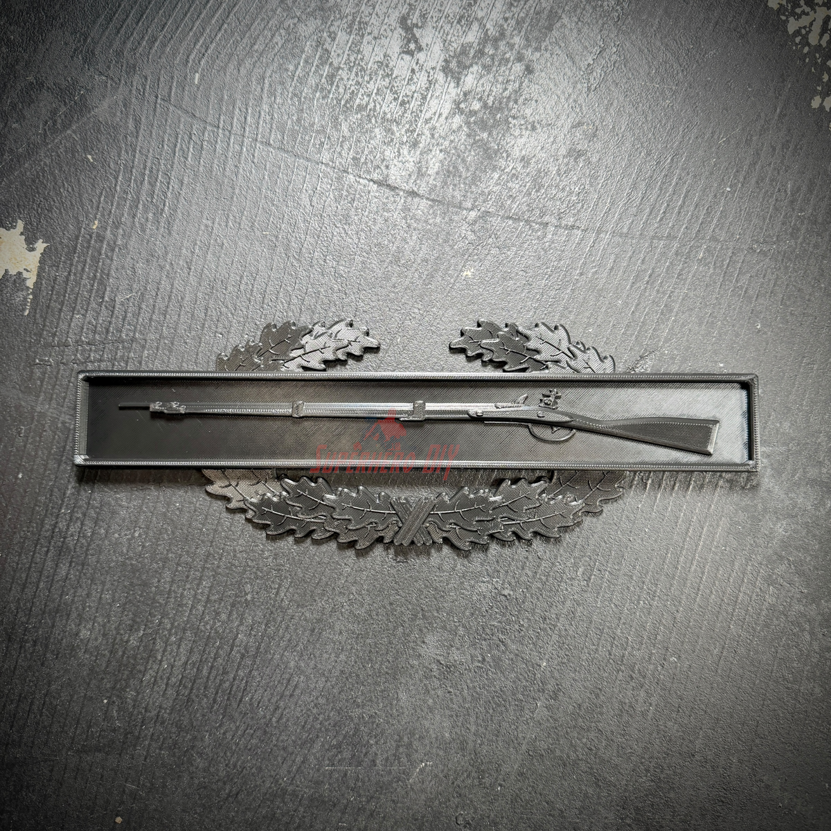 Combat Infantryman Badge display with 1795 Springfield musket on an oak wreath background.