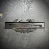 Combat Infantryman Badge display with 1795 Springfield musket on an oak wreath background.
