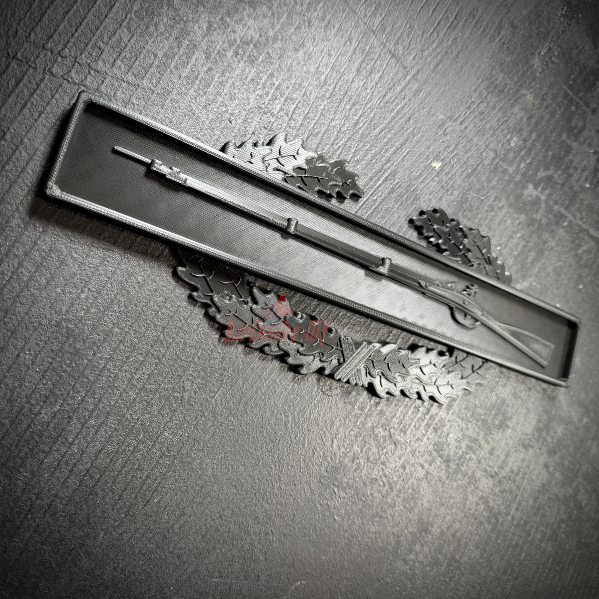 Combat Infantryman Badge display featuring a musket on an oak wreath, emphasizing military insignia.