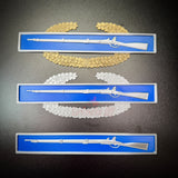 Expert Infantryman Badge, Combat Infantry Badge, and MCIB replicas in multiple sizes, showcasing combat rifles on decorative blue and gold backgrounds.