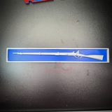 3D-printed model of a rifle displayed on a blue background in a protective case