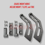 Set of Skadis-mount hooks with mount, T-clips, and tool on a gray background