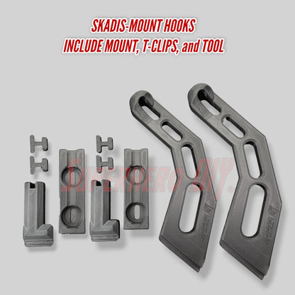 Set of Skadis-mount hooks with mount, T-clips, and tool on a gray background