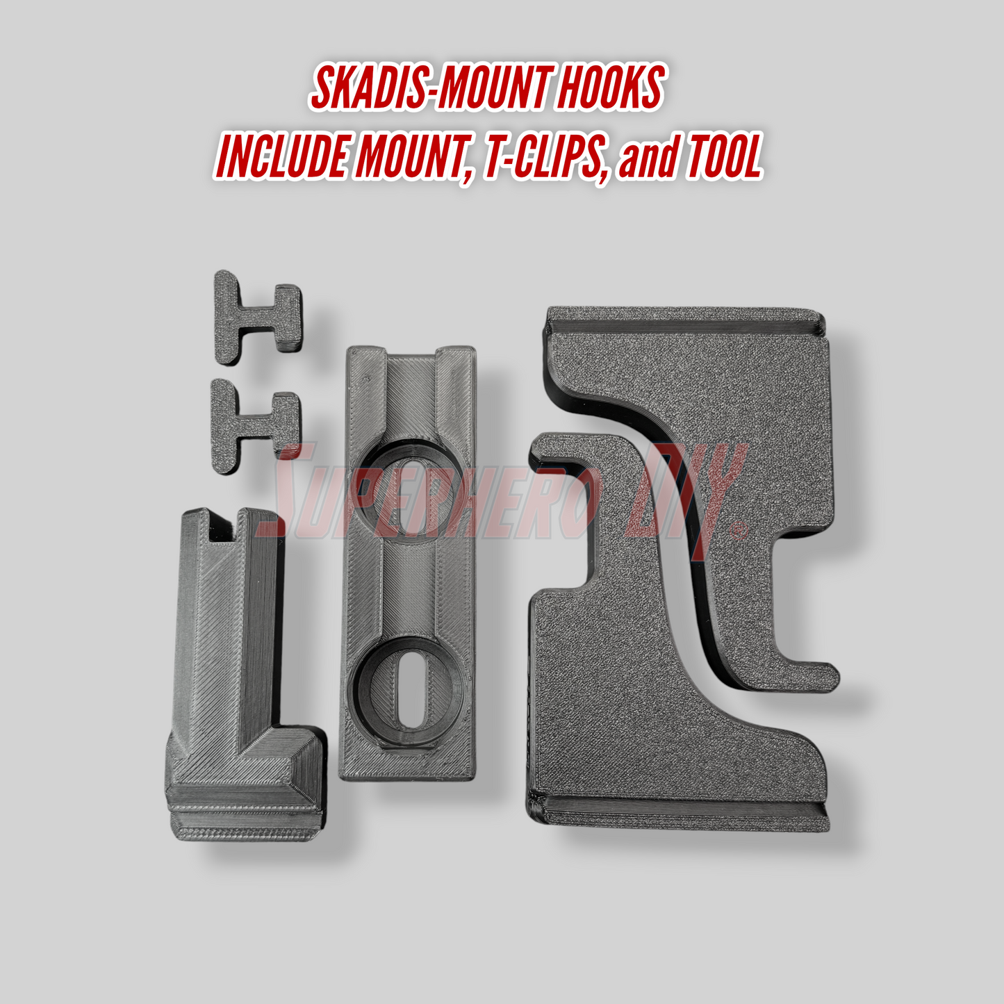 Set of Skadis-mount hooks with mount, T-clips, and tool on a gray background