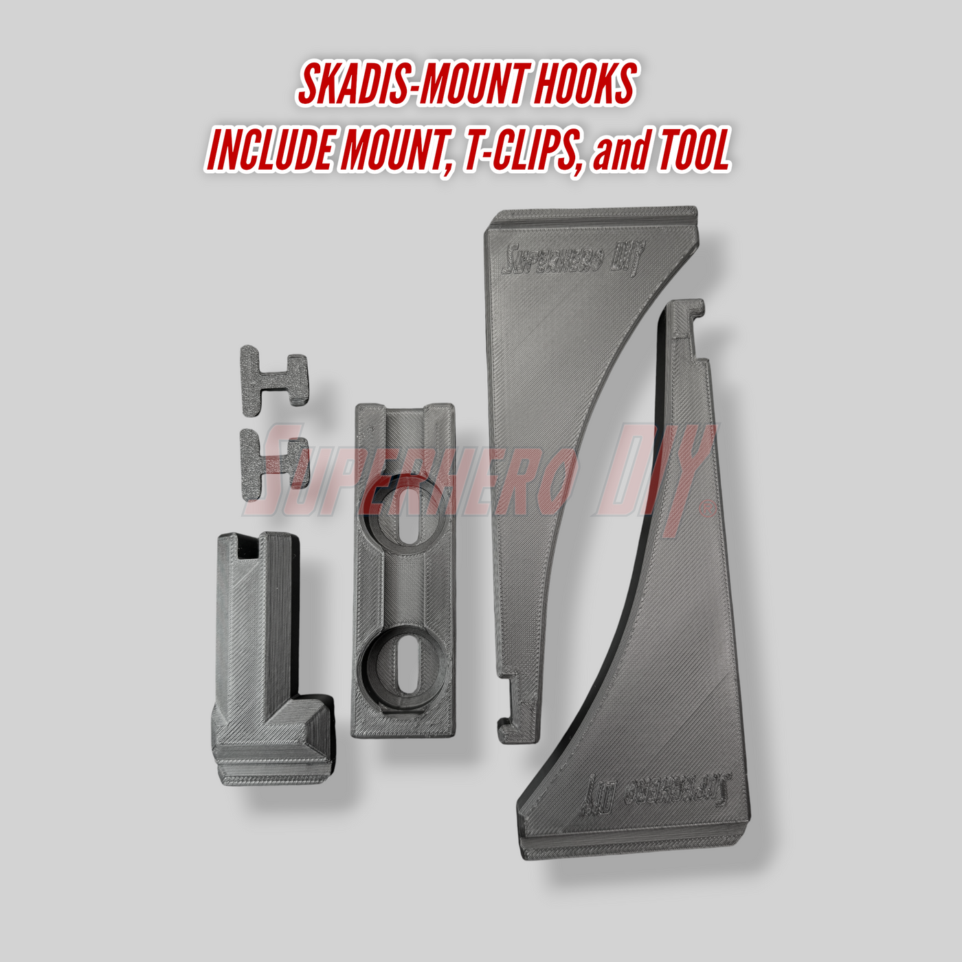 Skadis-mount hooks with mount, T-clips, and tool on a gray background