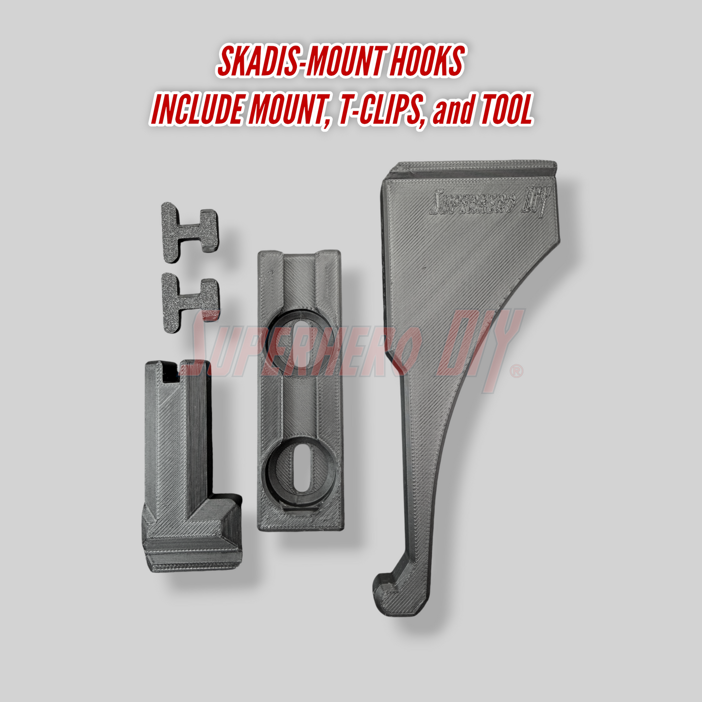 Skadis-mount Elbow Pad hook with mount, T-clips, and tool on a gray background
