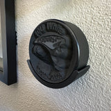 Hockey puck holder wall mount featuring a detailed design, ideal for displaying championship pucks.