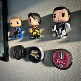 Hockey puck holder wall mount displaying collectibles and Stanley Cup Final hockey puck.