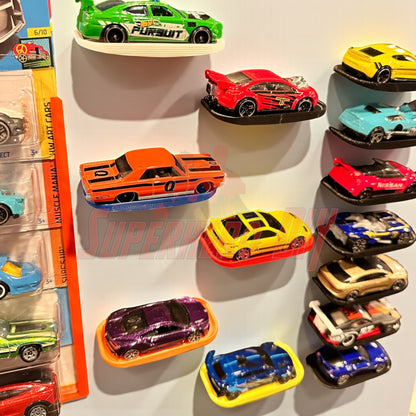 Display shelf for Hot Wheels showcasing 1:64 diecast cars with command strip included, organized neatly on a wall.