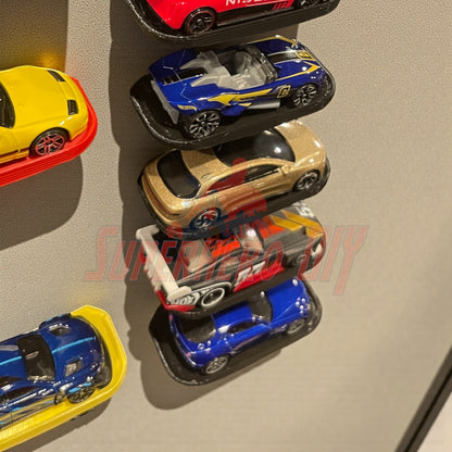 Floating display shelf for Hot Wheels or 1:64 vehicles, neatly showcasing diecast cars with command strip included.