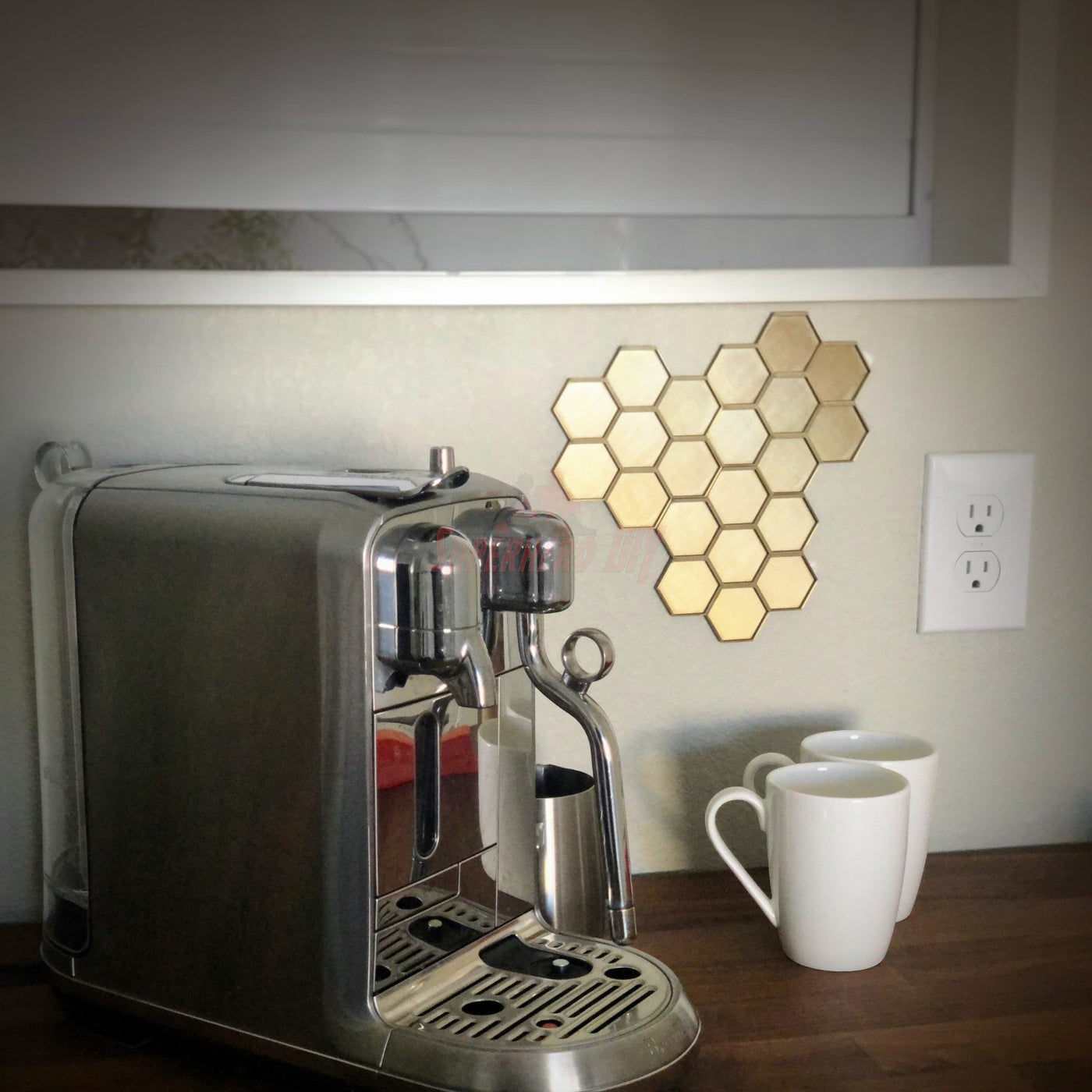 Honeycomb wall mount for original nespresso coffee pod organizer displayed next to an espresso machine and cups.
