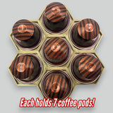 Original Nespresso coffee pod organizer holding 7 capsules per hex piece, showcasing modular design.