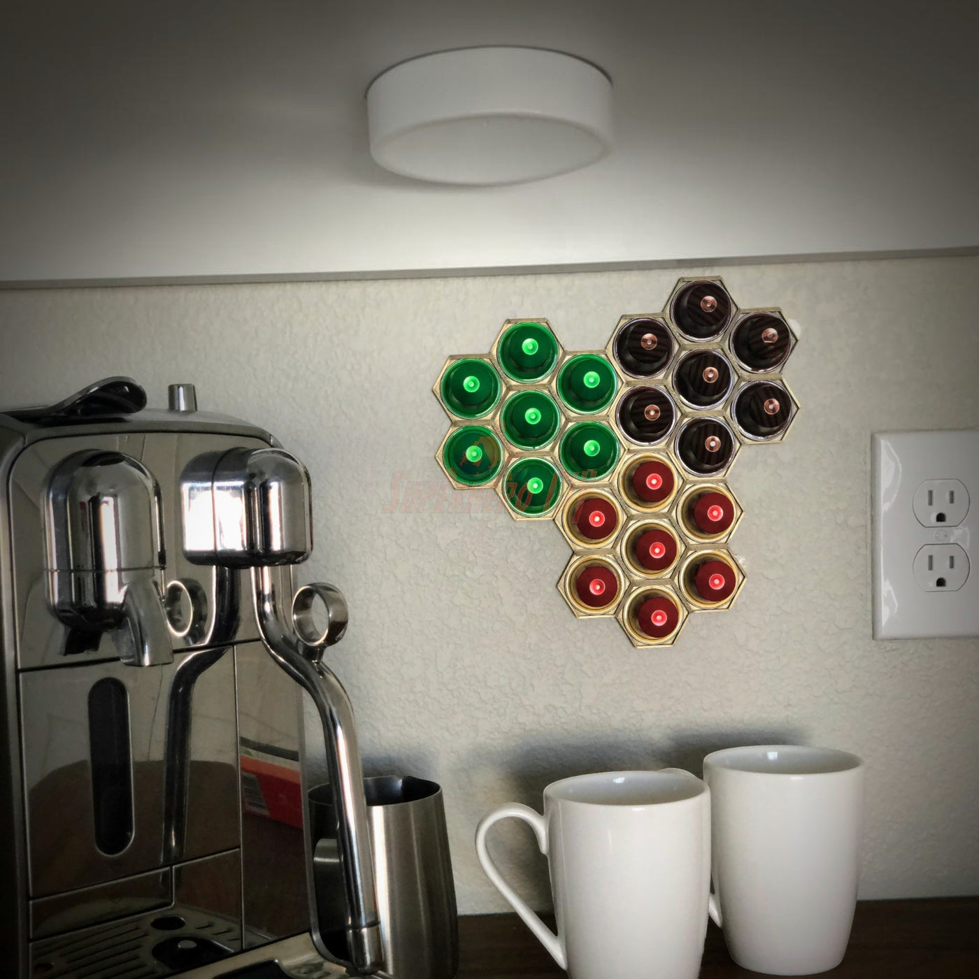 Honeycomb wall mount for original nespresso coffee pod organizer, displaying various colored capsules.