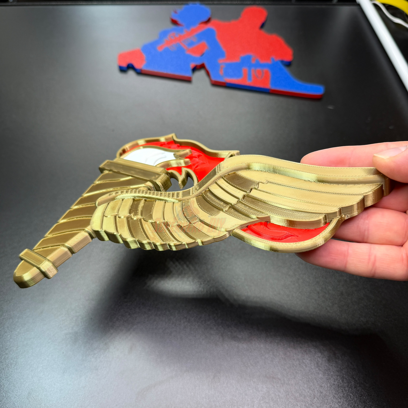 Army Pathfinder Badge displayed with a winged torch design, showcasing the full-color red and gold finish.